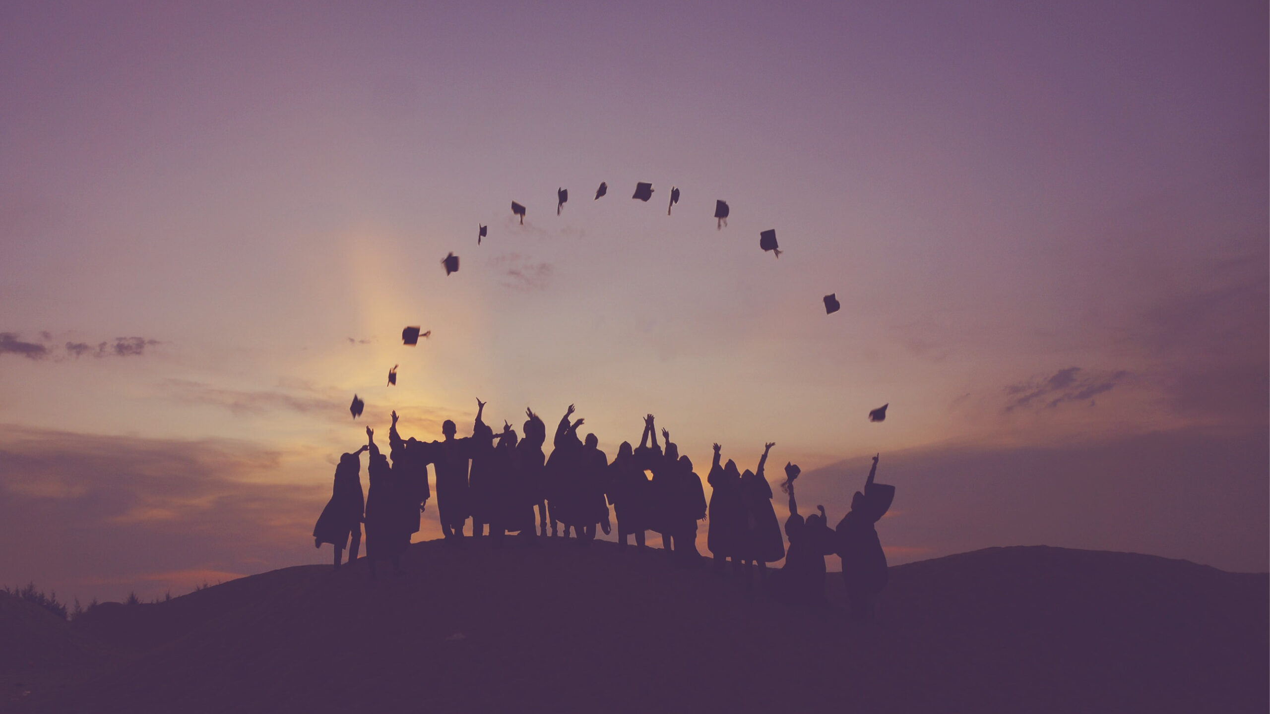 Graduates throwing caps